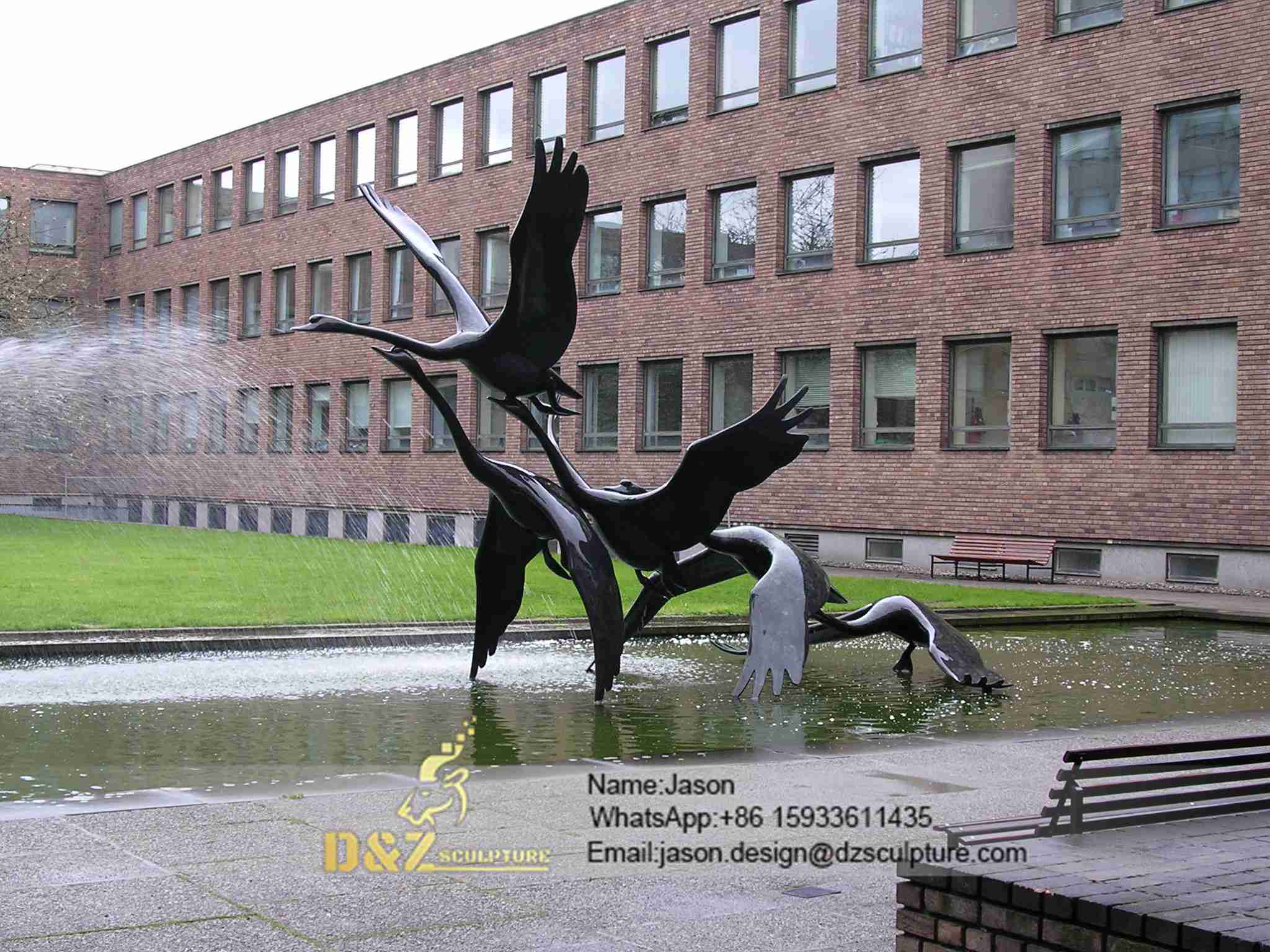Swans in flight statue 