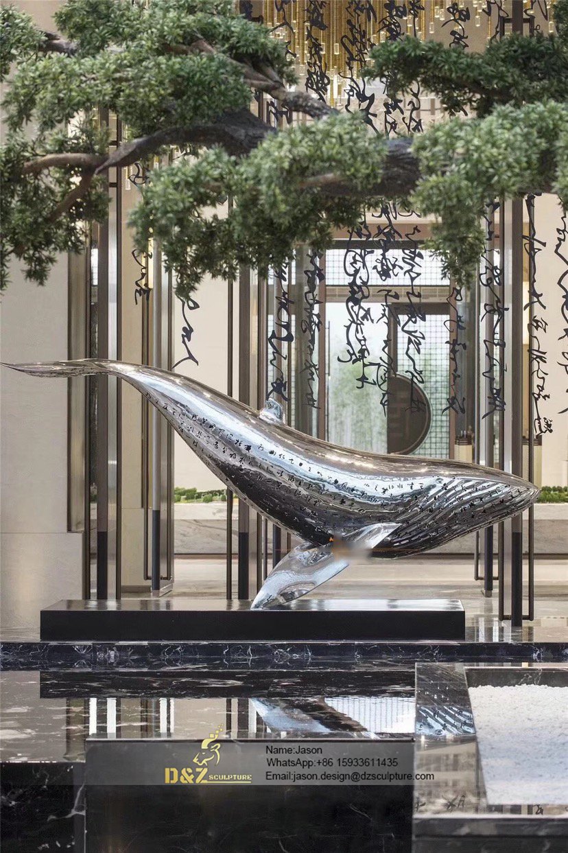 Polished stainless steel dolphin sculpture