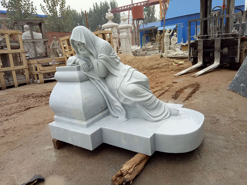 Seat and white marble statue